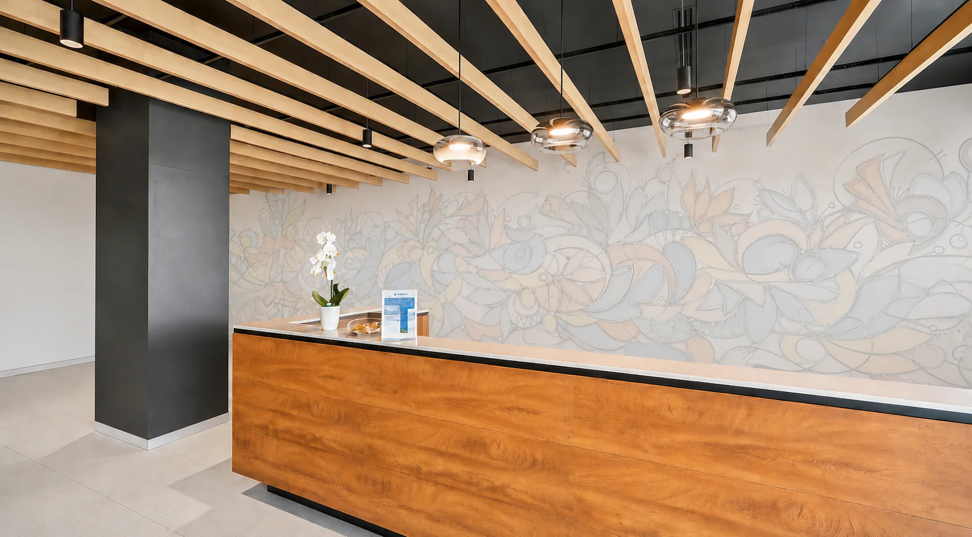 Metro Parc reception desk with architectural wood beams and columns